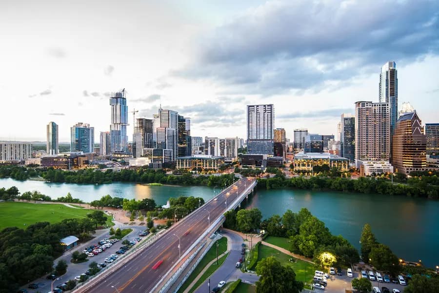 Downtown Austin skyline above Lady Bird Lake and the Congress Avenue Bridge