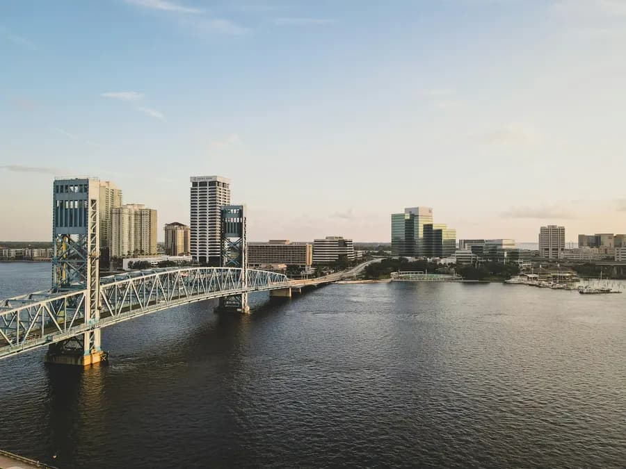 Jacksonville riverfront with a steel bridge crossing the St. Johns River