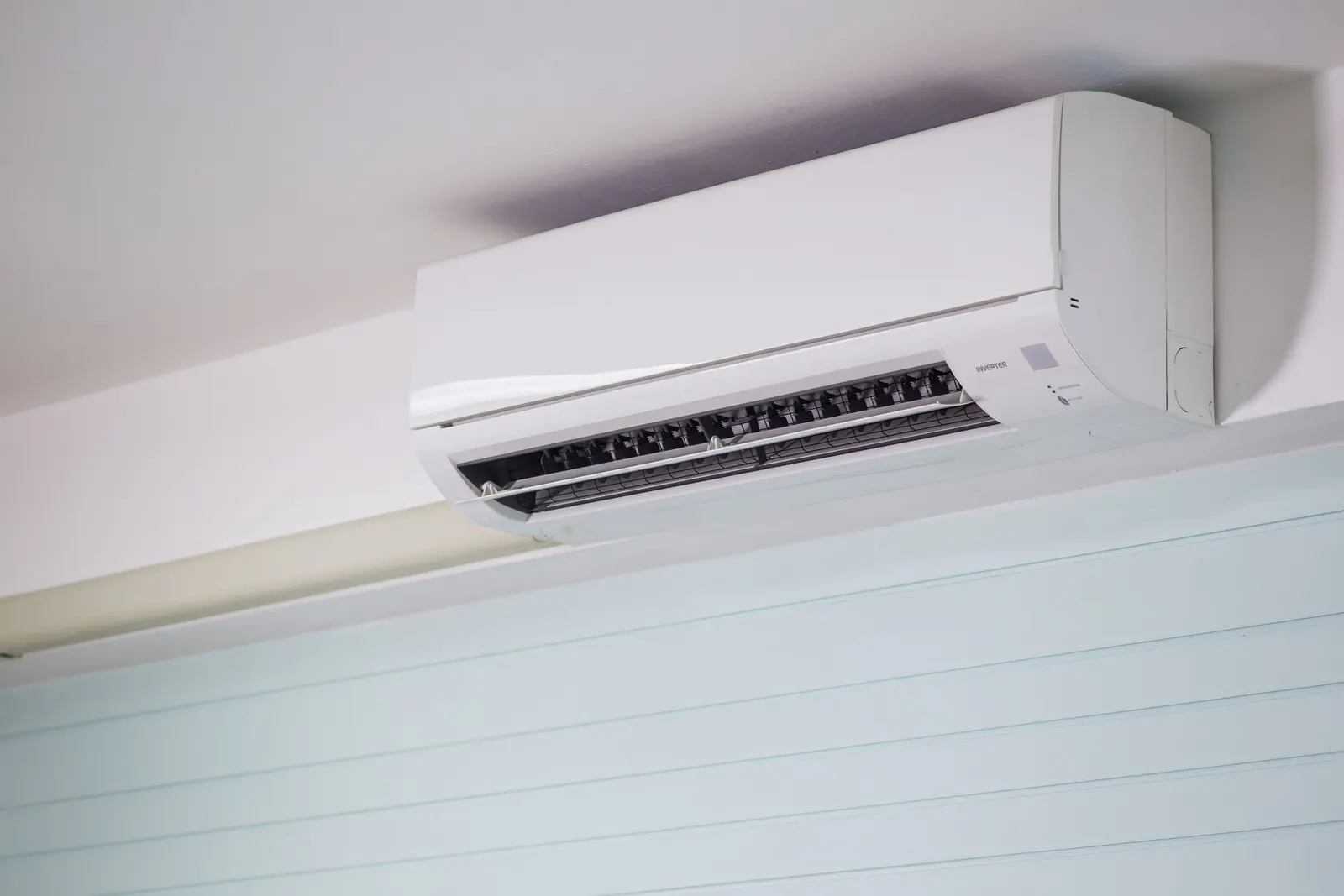 Ductless mini-split indoor head mounted high on a wall
