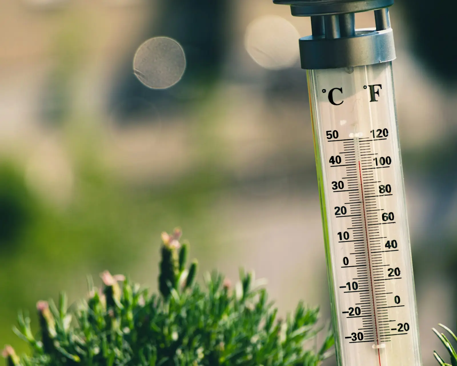 An outdoor thermometer marked in Celsius and Fahrenheit
