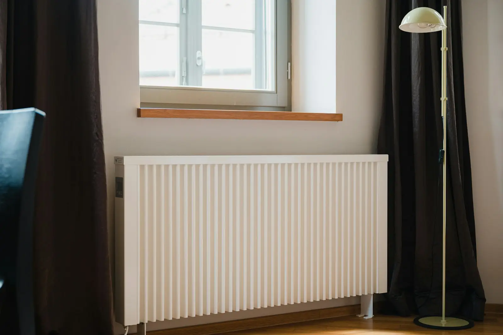 A white panel radiator under a window